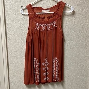 Woman’s orange tank top